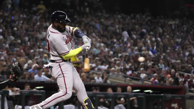 Jun 3, 2023; Phoenix, Arizona, USA; Atlanta Braves designated hitter Marcell Ozuna (20) hits an RBI single against the Arizona Diamondbacks during the fourth inning at Chase Field. Mandatory Credit: Joe Camporeale-USA TODAY Sports